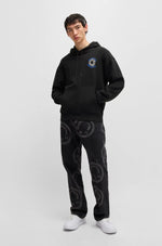 Load image into Gallery viewer, Hugo Blue | Nothentico Hoodie with Smiley Face Logo | 001 black
