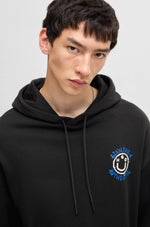 Load image into Gallery viewer, Hugo Blue | Nothentico Hoodie with Smiley Face Logo | 001 black
