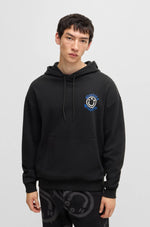 Load image into Gallery viewer, Hugo Blue | Nothentico Hoodie with Smiley Face Logo | 001 black
