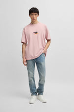 Lade das Bild in den Galerie-Viewer, Hugo Blue | Oversized T-Shirt mit Happy HUGO Logo | 680 light pastel pink
